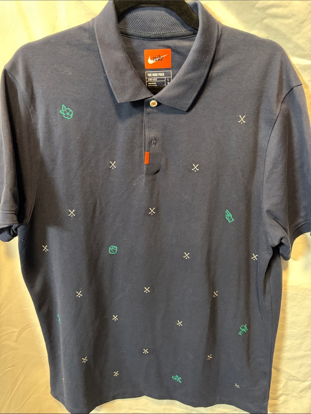 Nike Men’s Navy Polo with Teal Micro Embroidery